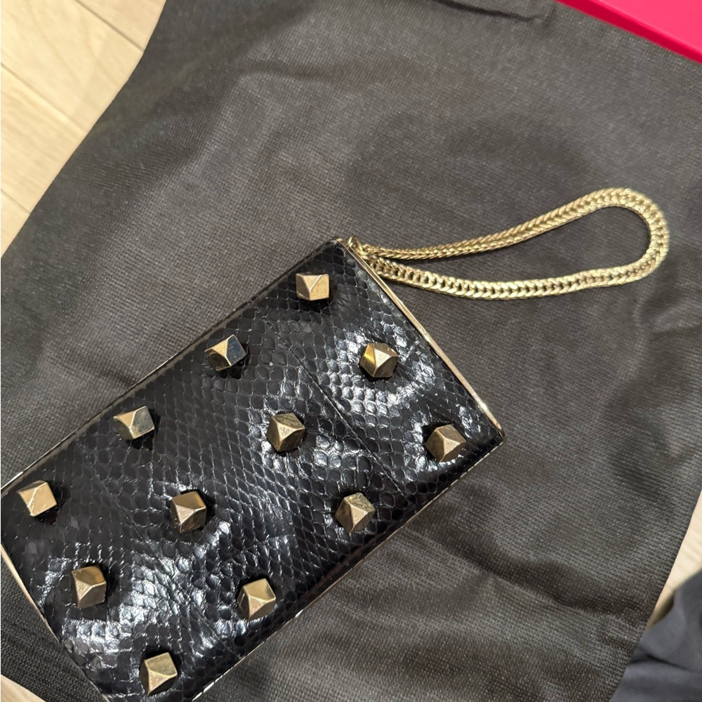 Jimmy Choo Black and Gold Studded Wristlet